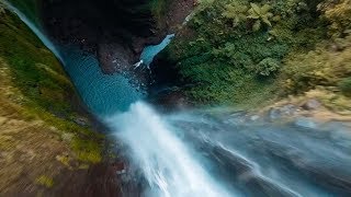 Drone Flies Through Jungle Waterfall [upl. by Burroughs]