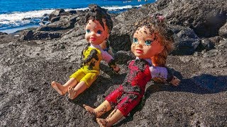 Elsa and Anna toddlers play with black sand on the beach [upl. by Rabah]